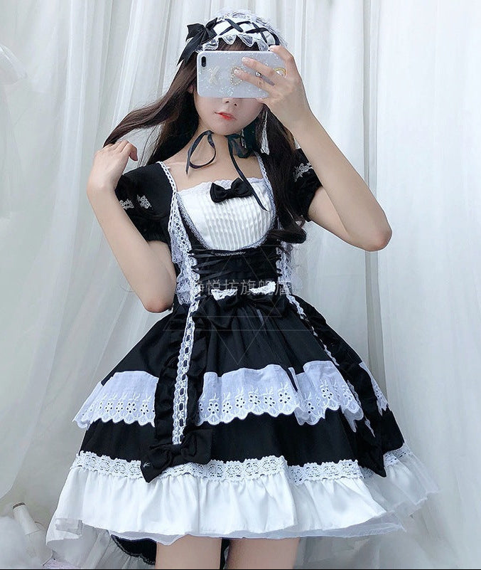 Women playful Lolita dress with elaborate lace and ruffle details Chichicherry