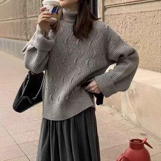 Padded knit sweater with roll neck