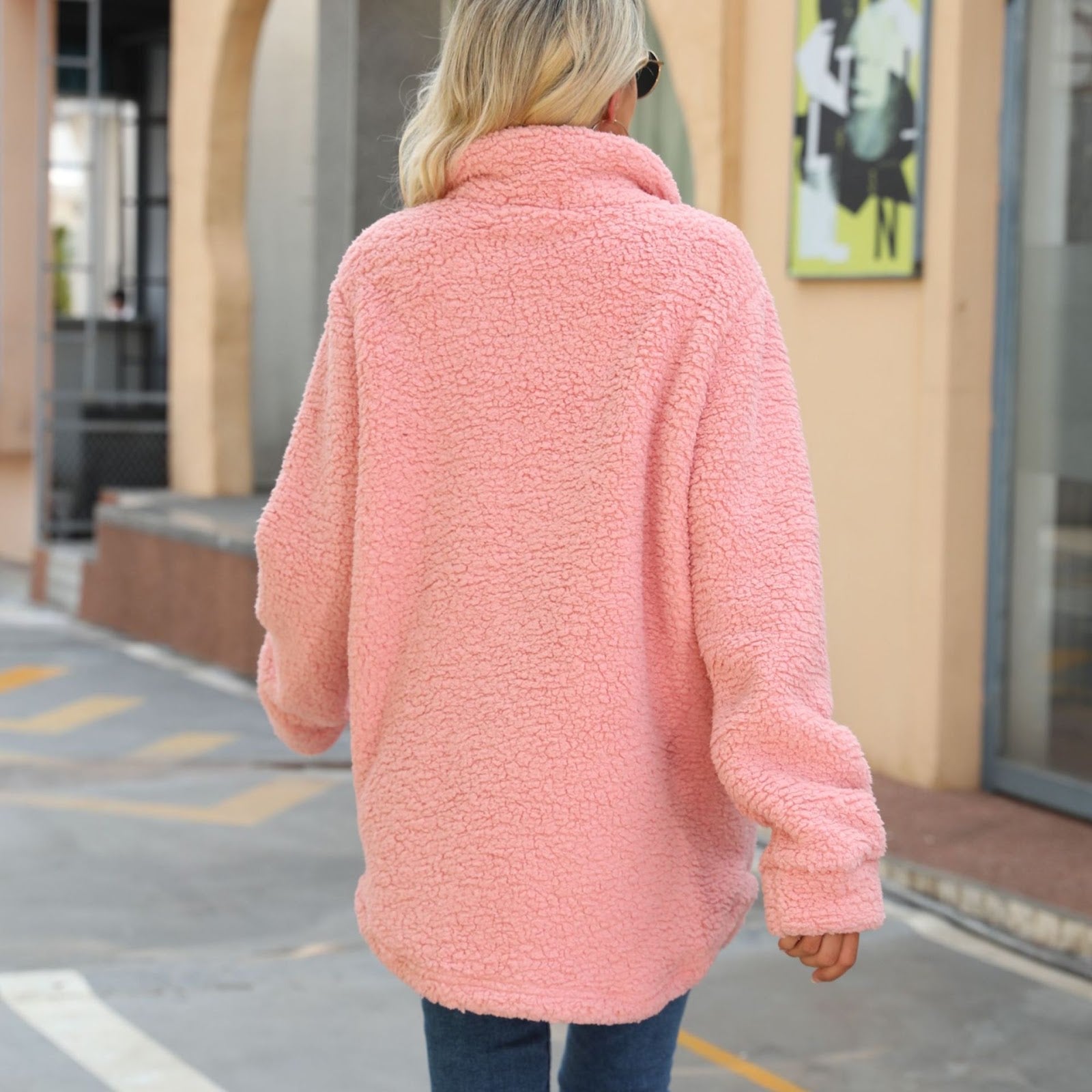 Long women's coat made of soft plush with notched collar