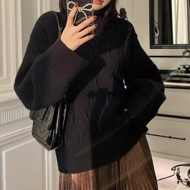 Padded knit sweater with roll neck