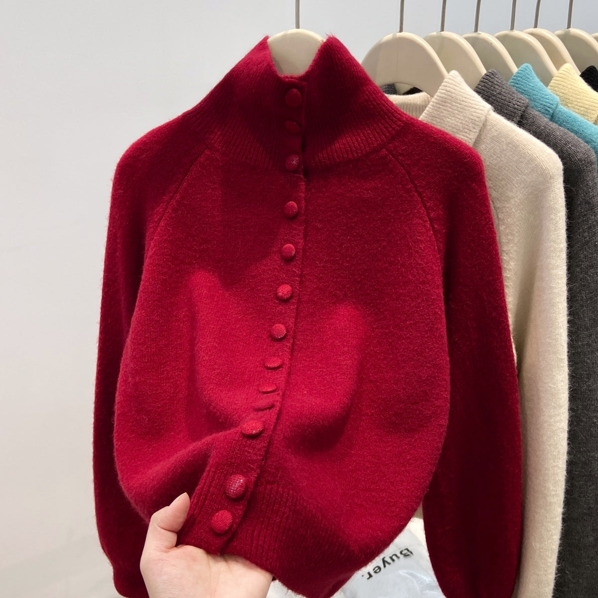 Ladies' cardigan with standing collar and button placket