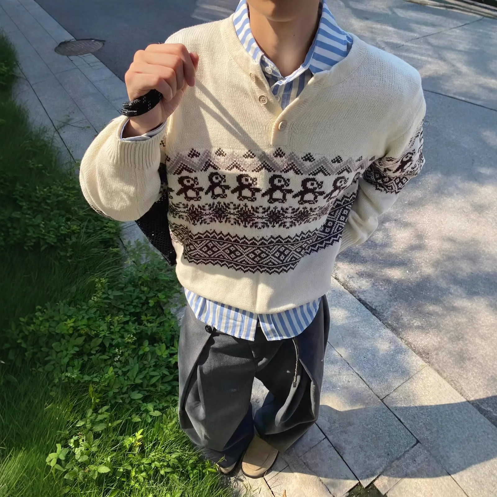 Unisex knitted sweater with fair isle pattern and button placket