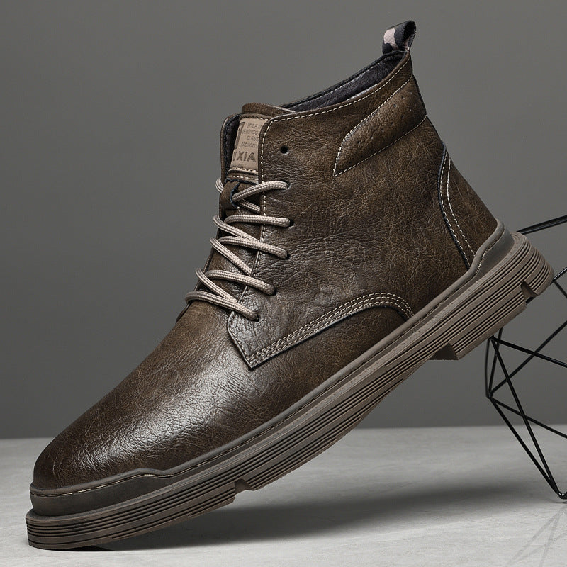 Padded men's leather boots with decorative stitching