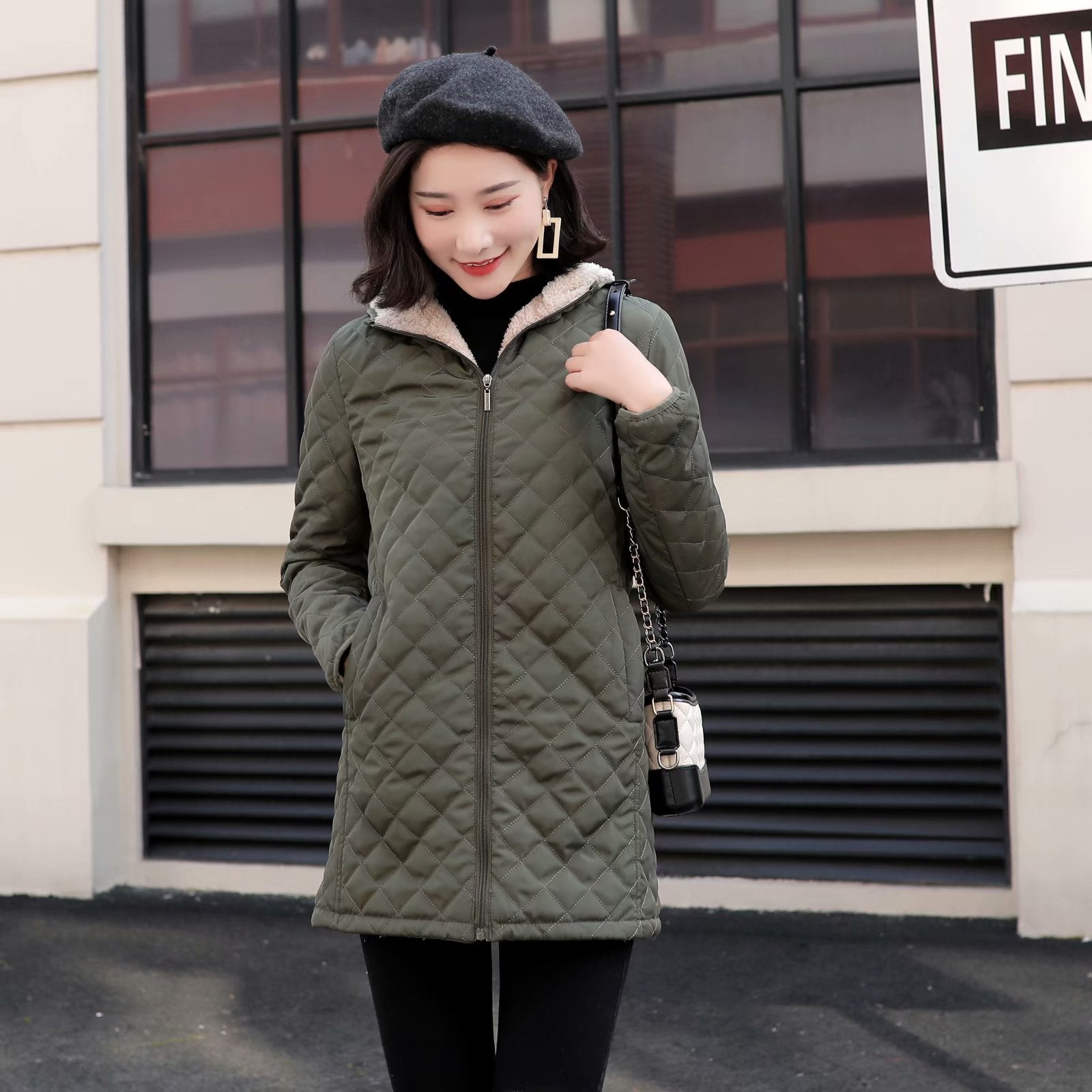 Women's quilted coat with hood and lambskin look