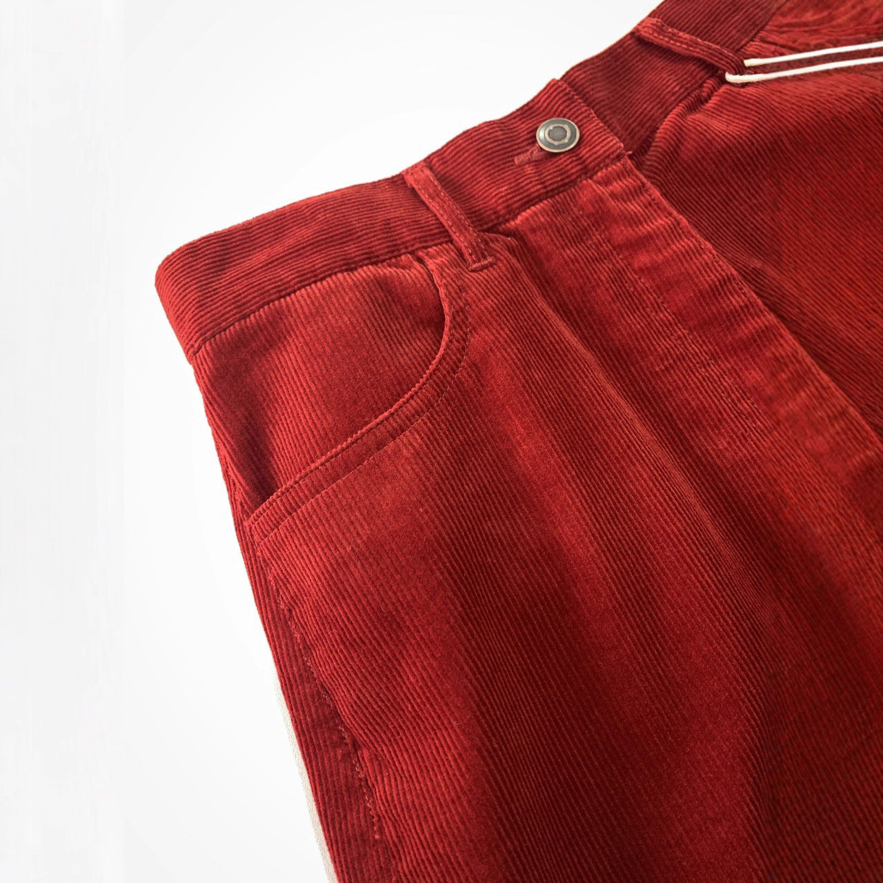 Red corduroy pants with wide leg and high waist