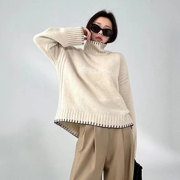 Women's knit sweater with cable pattern and turtleneck