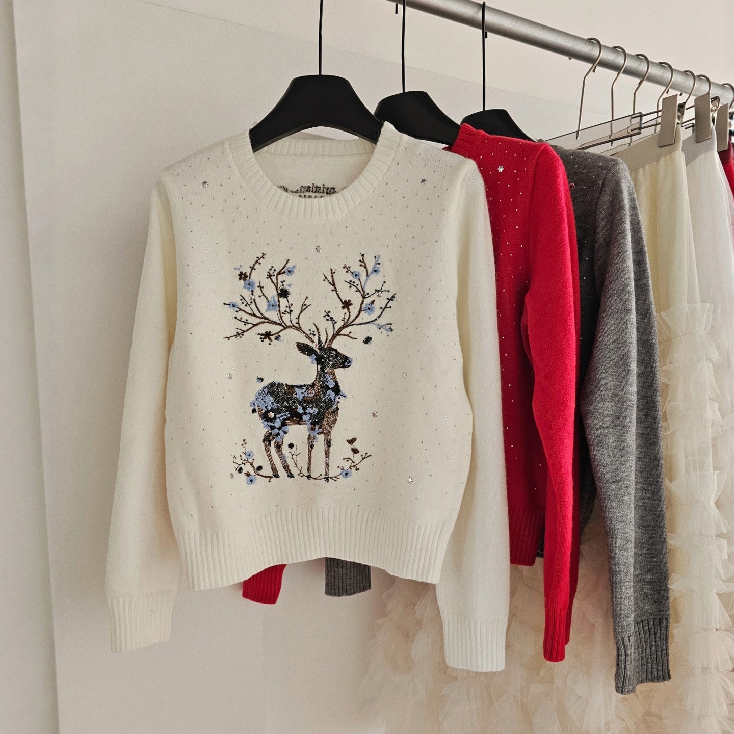Knitted sweater with reindeer embroidery and sequins