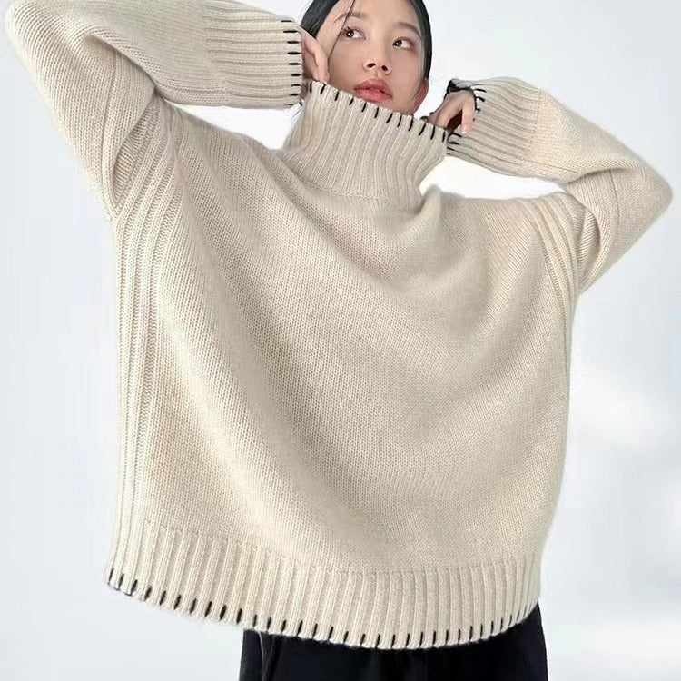 Women's knit sweater with cable pattern and turtleneck