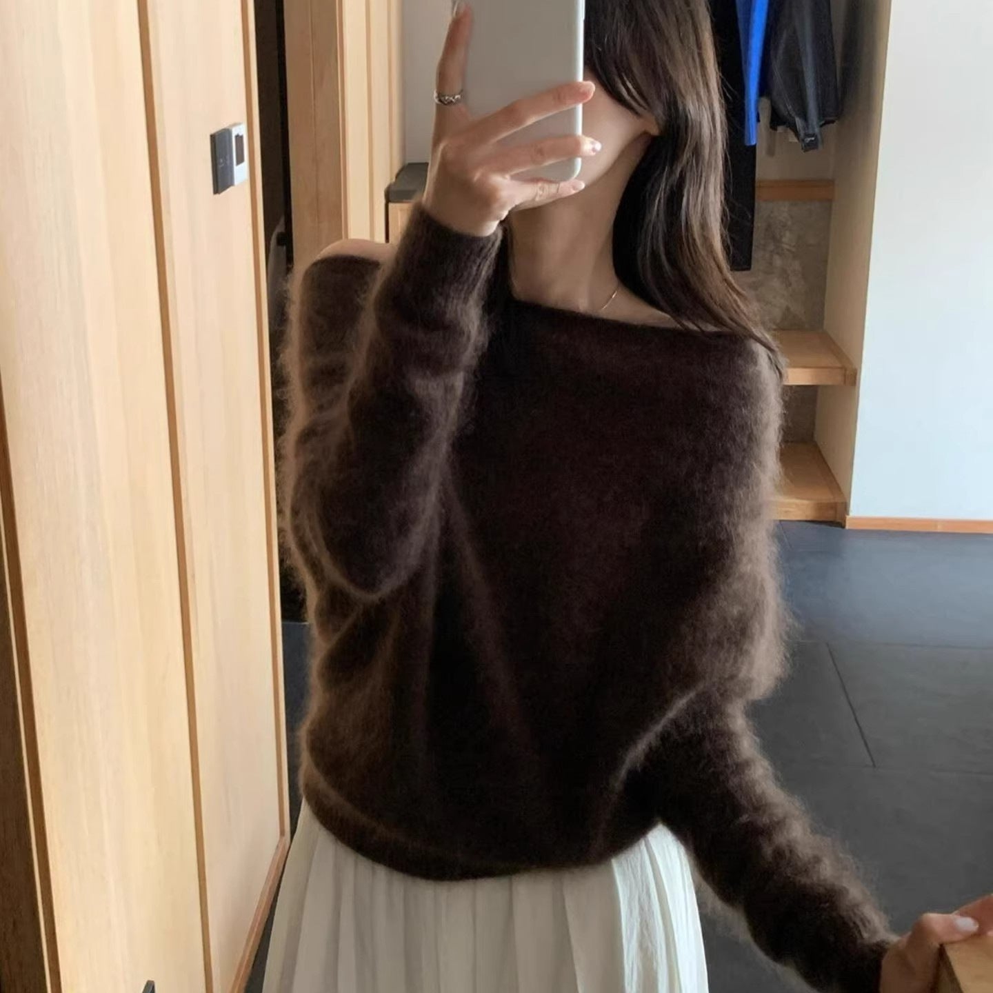 Women’s knit sweater with off-the-shoulder neckline, loose