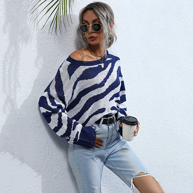 Women’s oversized knit sweater with zebra stripe jacquard, frayed hem, and raglan sleeves Chichicherry
