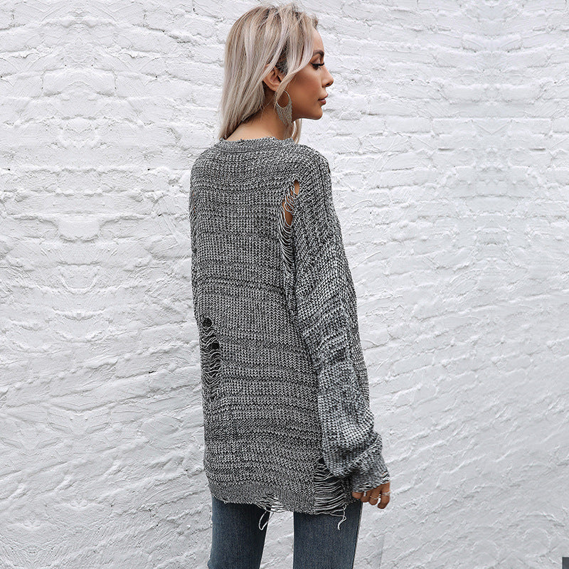 Ladies chunky knit oversized sweater with open stitches, raw hem and round neckline Chichicherry