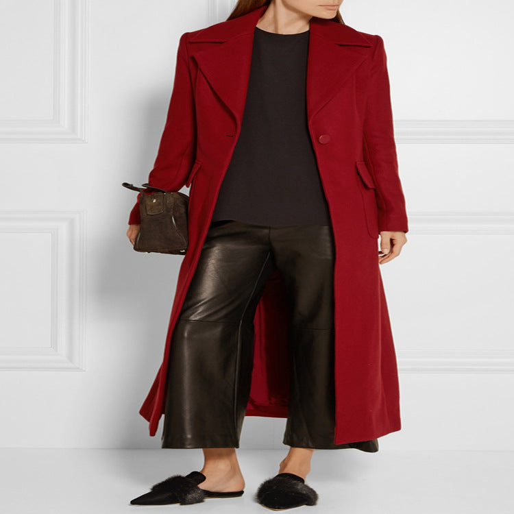 Women's maxi-length wool blend coat with tailored seam design, knife pleats, and flap pockets Chichicherry