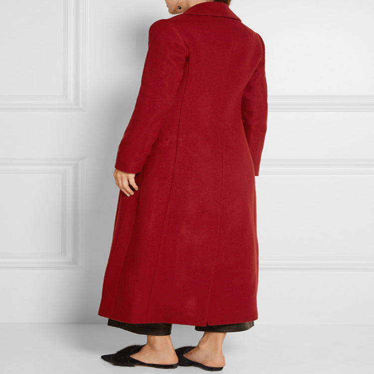 Women's maxi-length wool blend coat with tailored seam design, knife pleats, and flap pockets Chichicherry