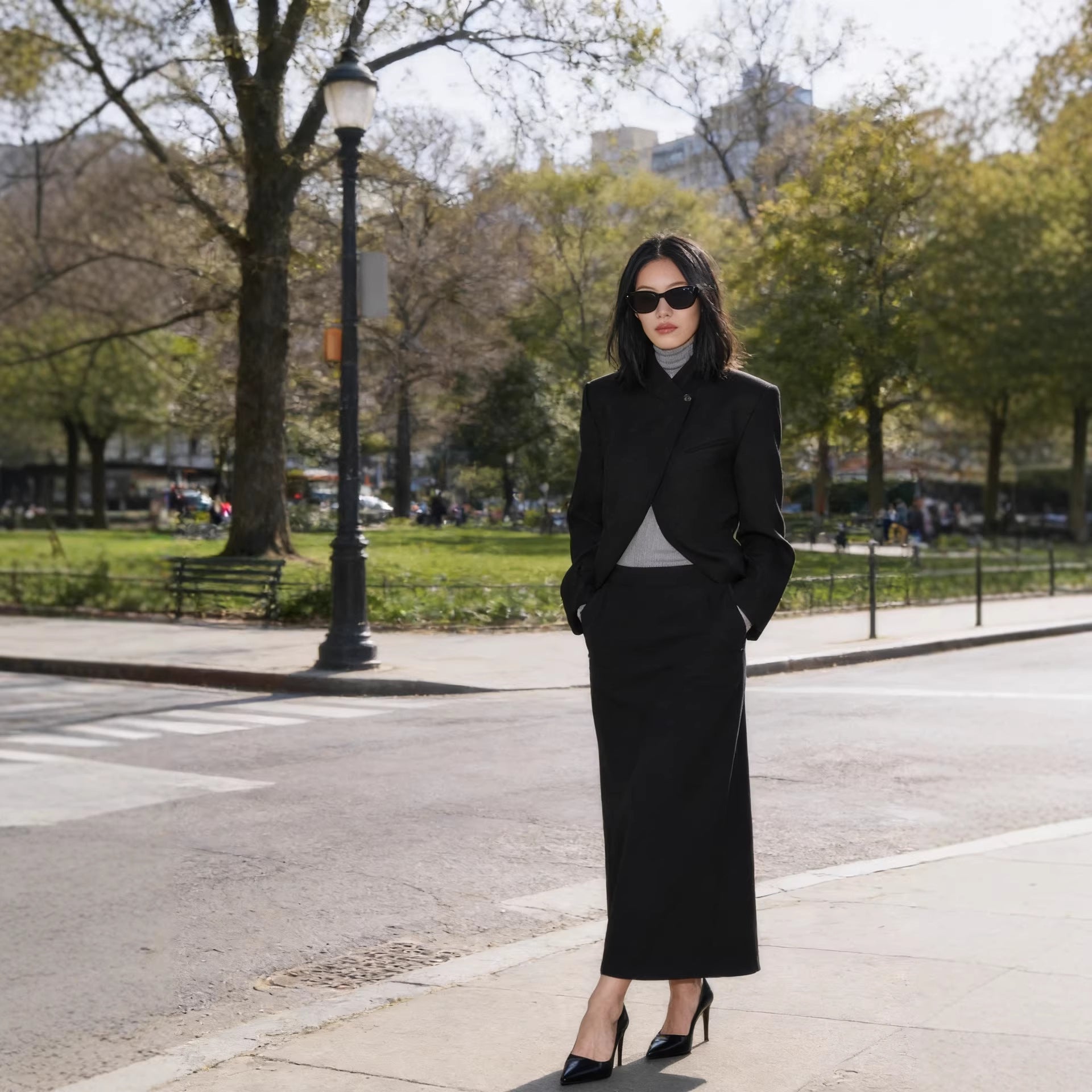 Women's structured short blazer in a minimal style with stand-up collar and concealed button placket Chichicherry
