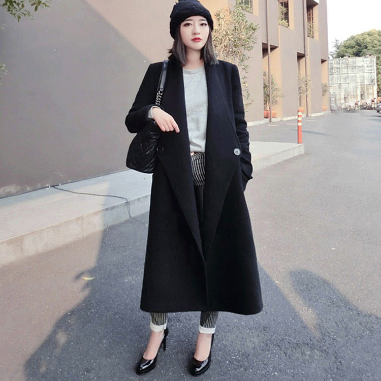 Women's midi-length tailored wool blend long coat with shawl collar, inset pockets, and discreet decorative buttons Chichicherry