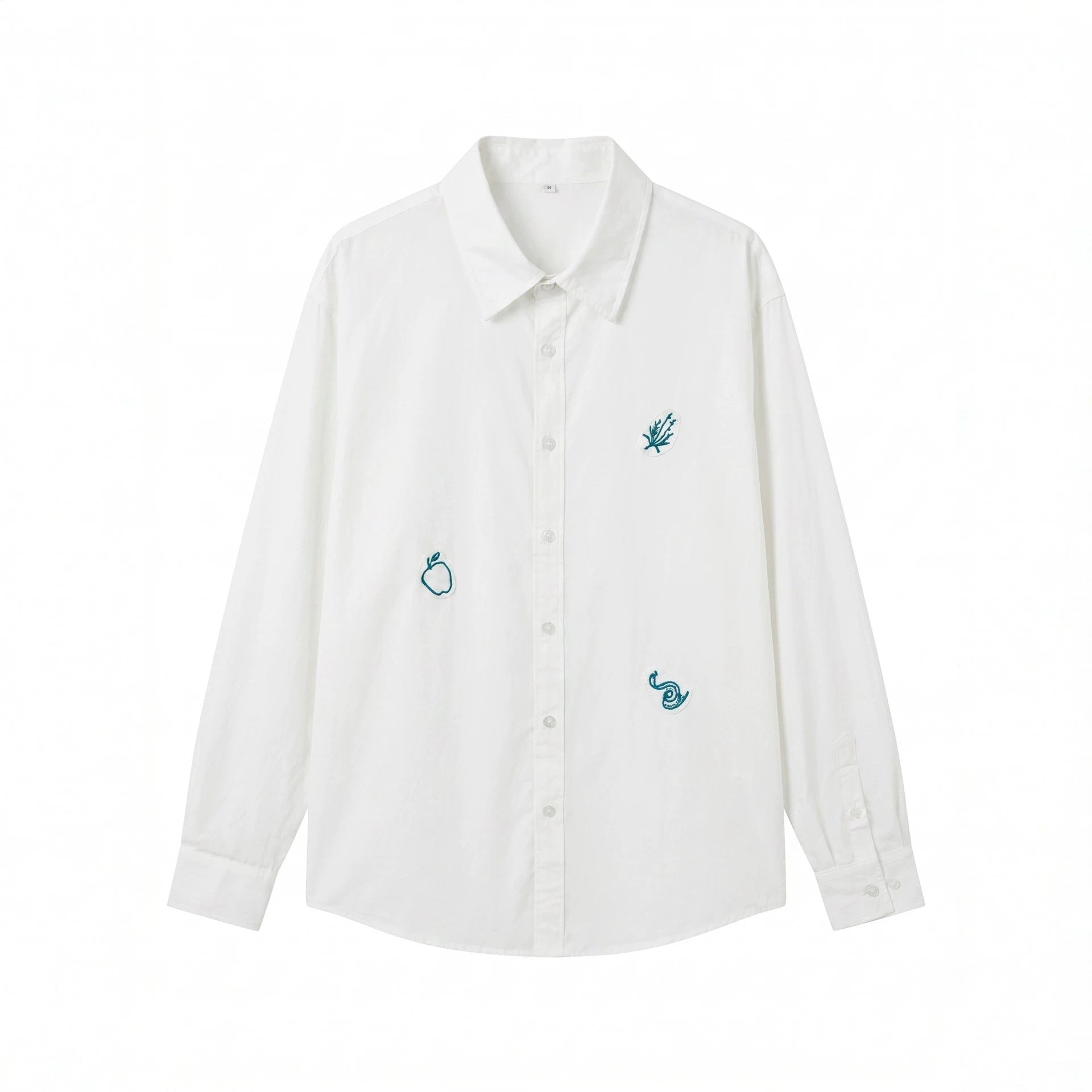 Women's oversized shirt blouse with fine embroidery appliqués and extended hem.