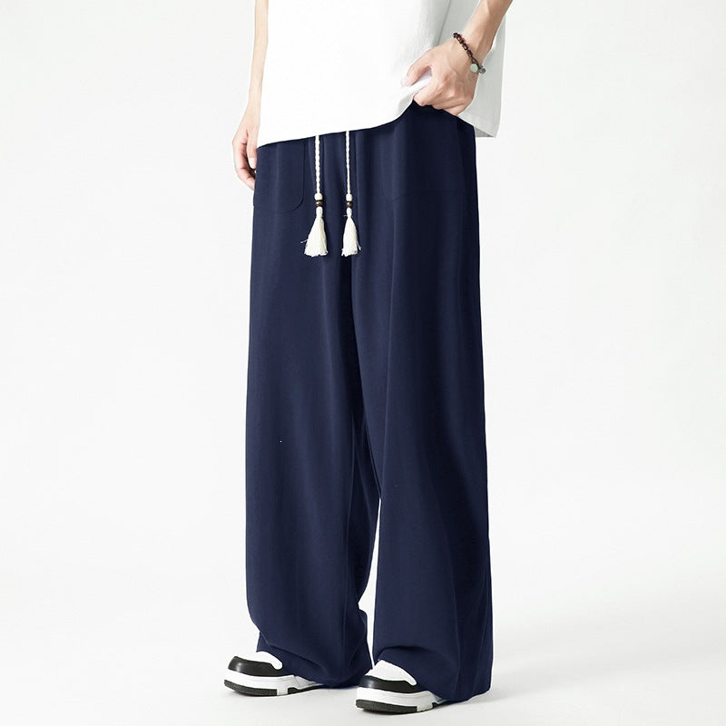 Men's loose-fitting lounge pants with tassel cord, elastic waistband, and patch pockets Chichicherry