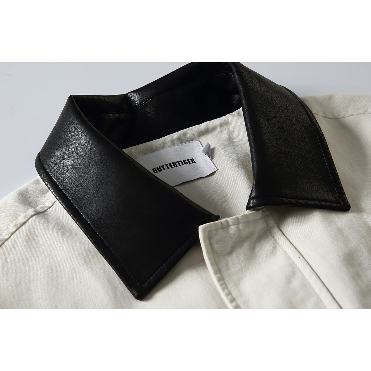 Men's short-cut boxy blouson jacket with faux leather collar, drawstring hem, and snap button cuffs Chichicherry