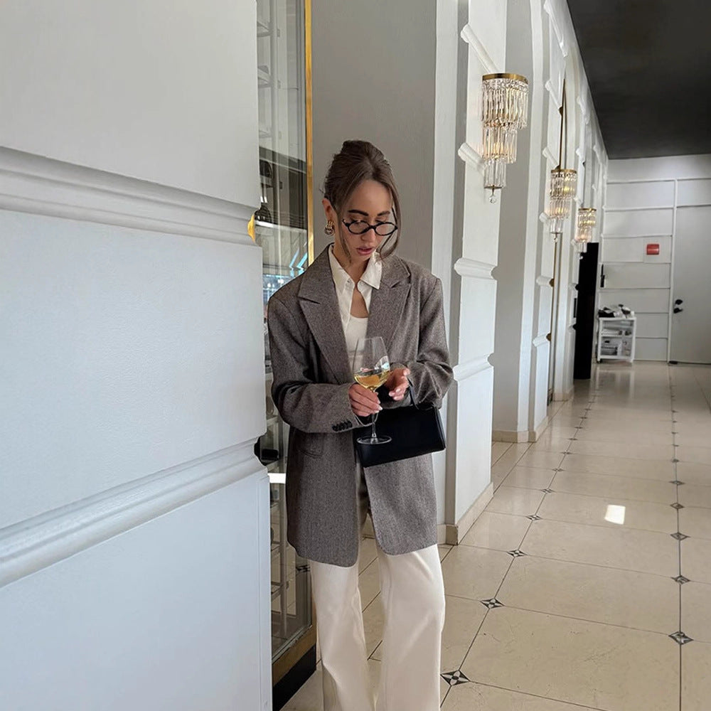 Women's long oversized wool blend coat with single-breasted button placket, notched lapels, and side pockets Chichicherry