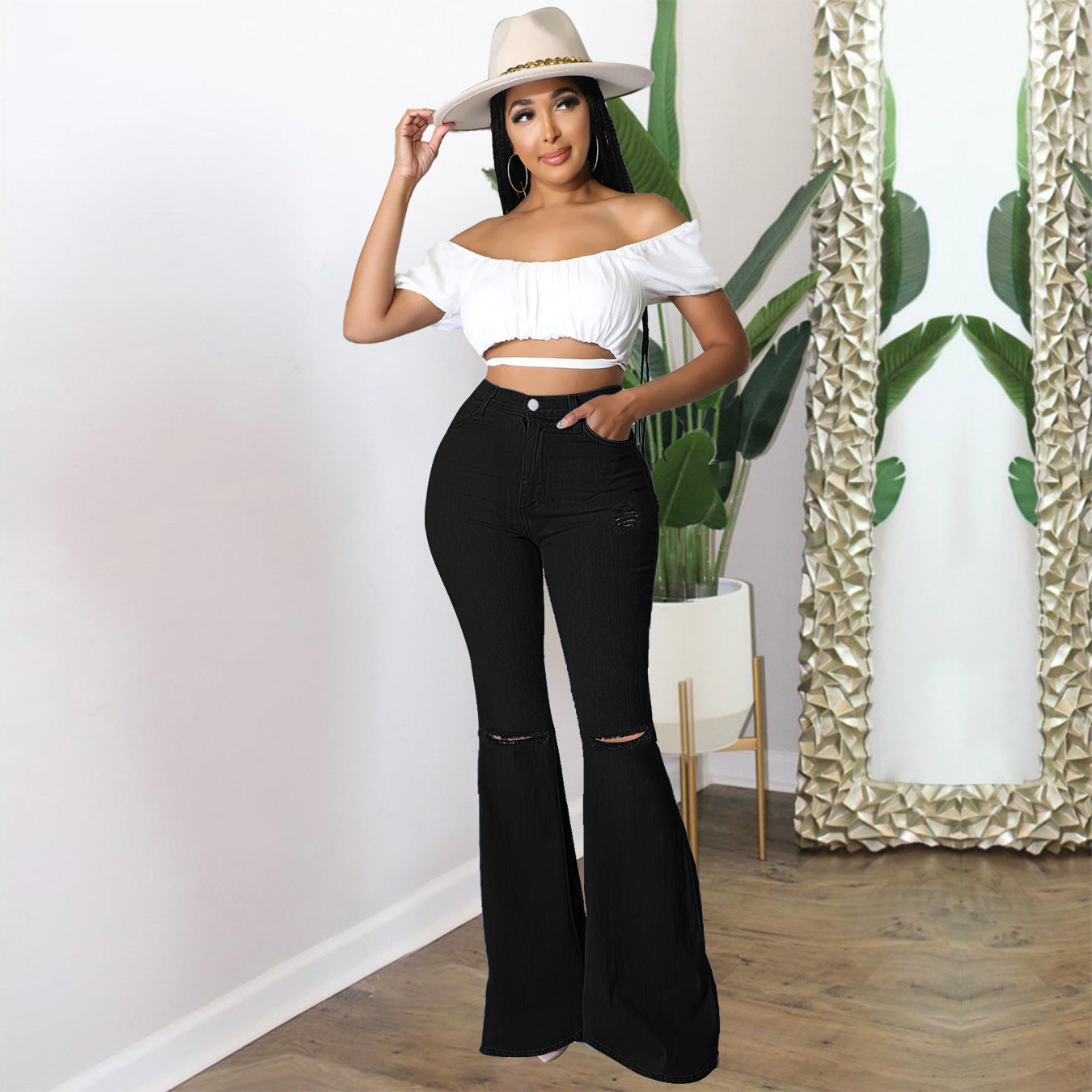 Women's high-waisted flared pants made of stretch denim with knee rips and shaping waistband Chichicherry