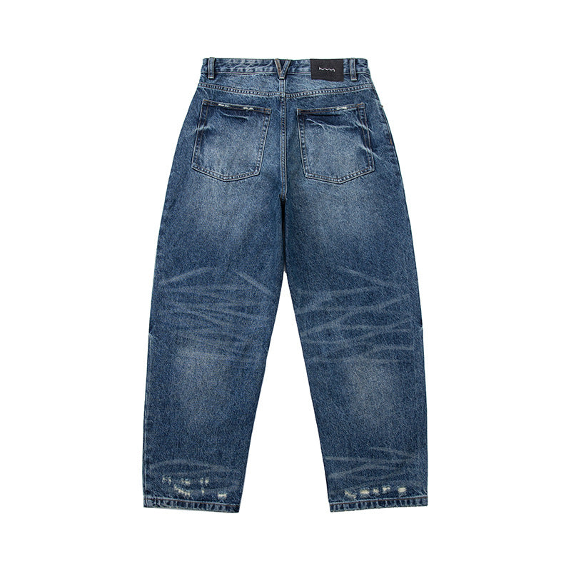Women's high-waisted wide-cut jeans in a used look with button closure and subtle rips