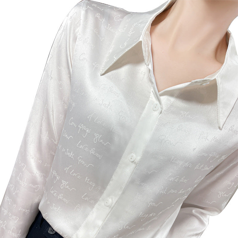 Women’s satin blouse with delicate jacquard writing, pointed shirt collar and continuous button closure Chichicherry