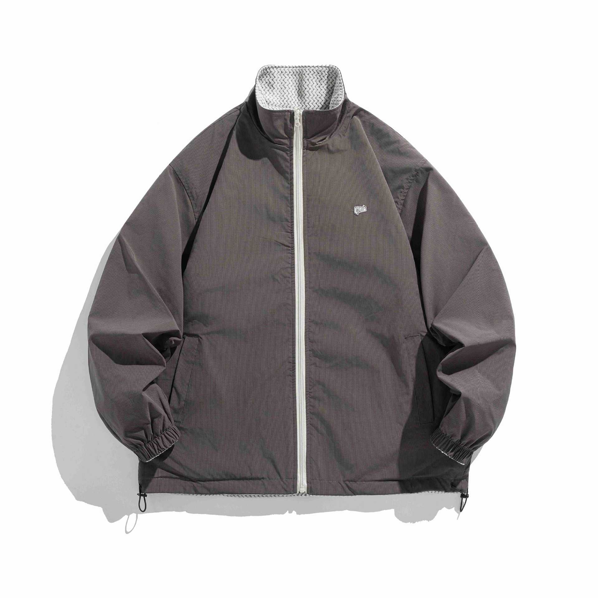 Unisex structure fleece jacket with high stand-up collar, zip pockets and drawstring hem Chichicherry
