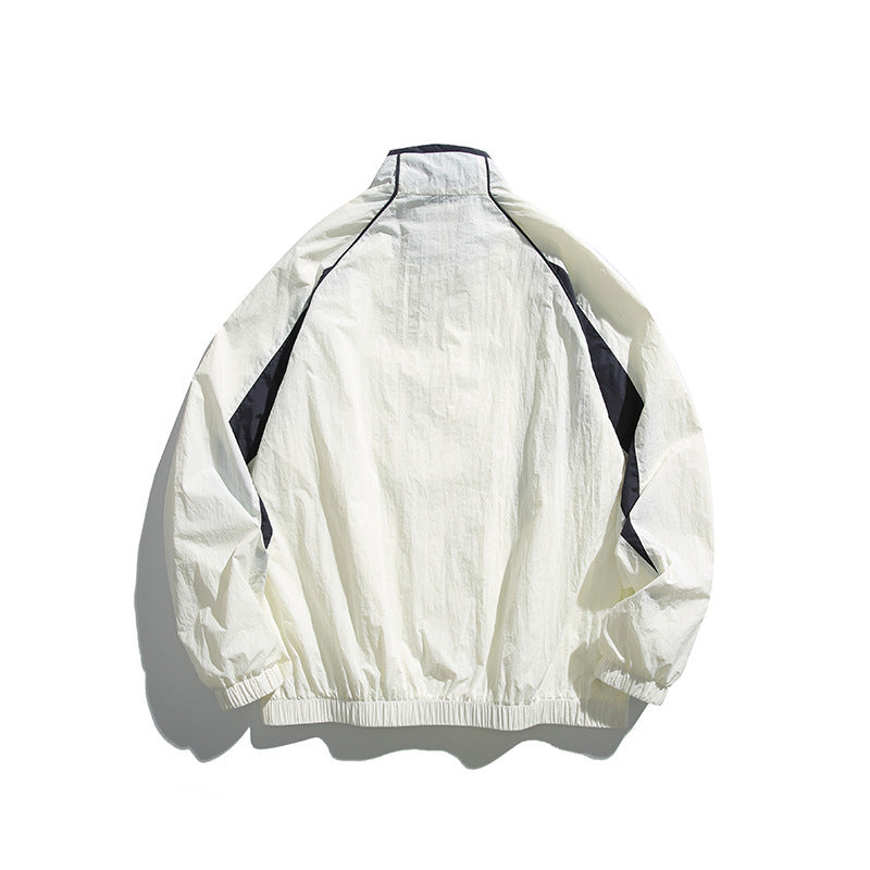 Unisex Lightweight Boxy Hooded Jacket in Windbreaker Style with Contrast Panels and Raglan Sleeves Chichicherry