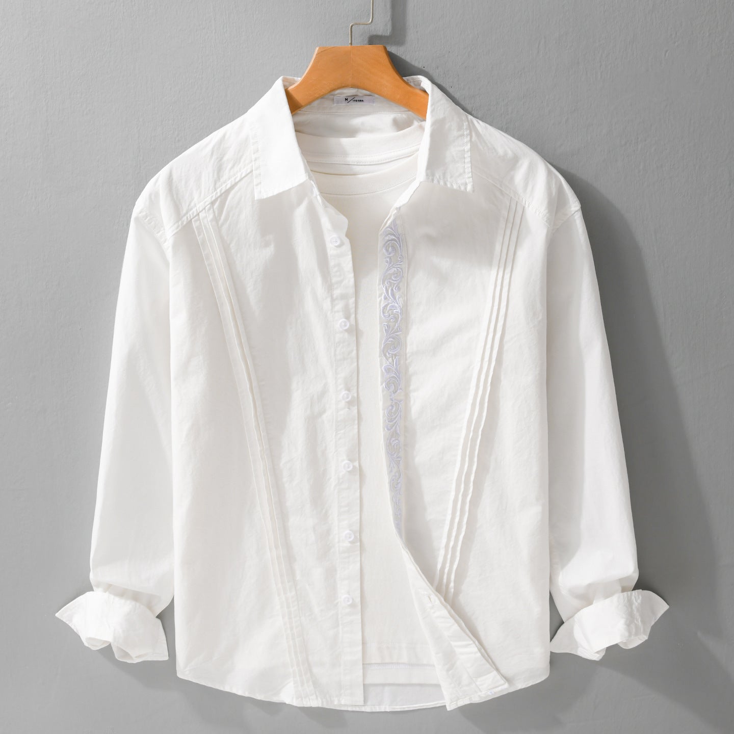 Women's cotton blouse with pleats, embroidery detail and relaxed-fit drape