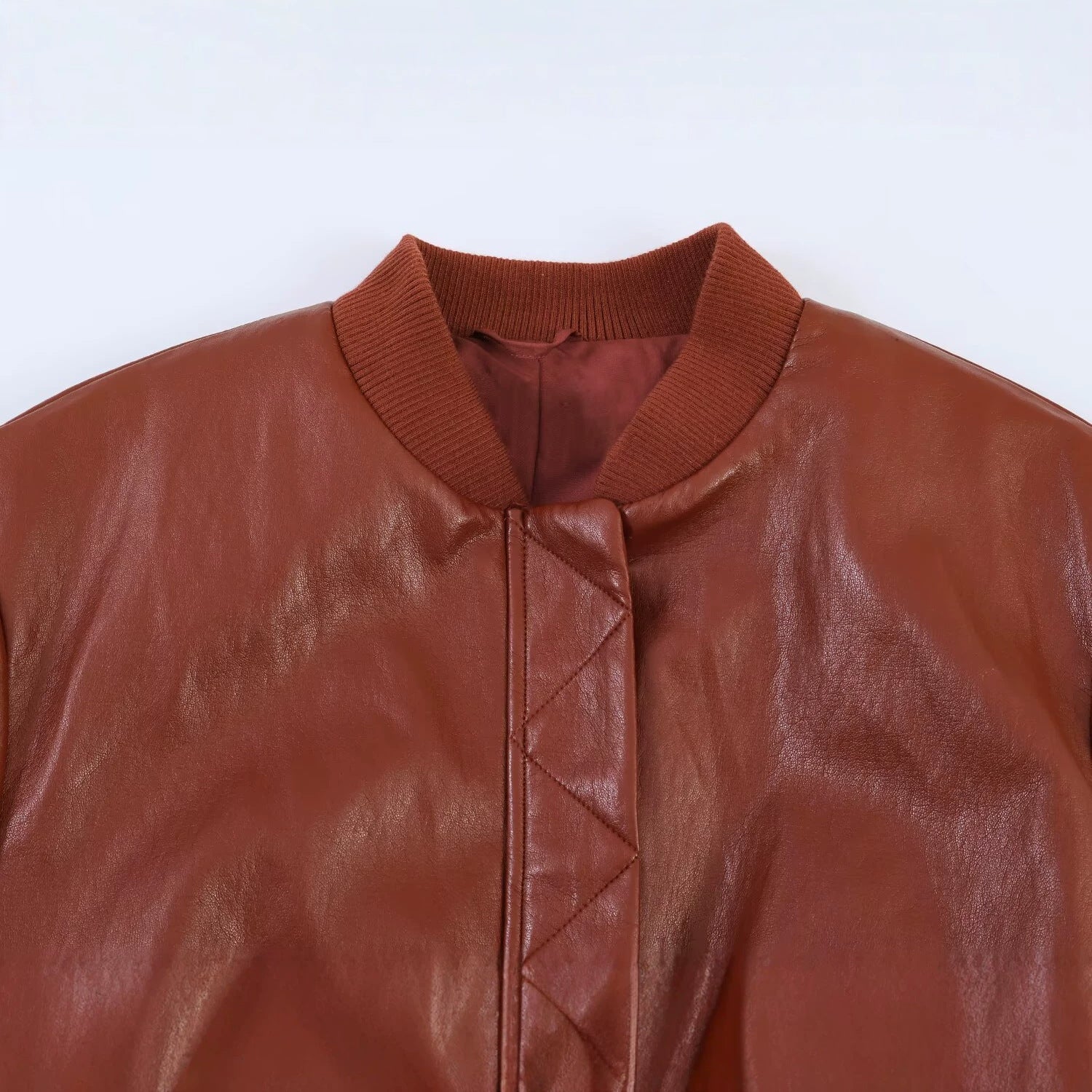 Women's Shiny Faux Leather Bomber Jacket with Ribbed Collar, Concealed Snap Button Placket and Kangaroo Pockets Chichicherry