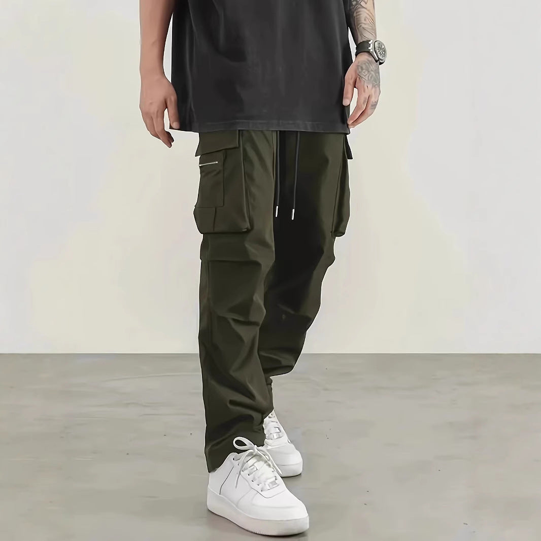 Men's wide technical cargo pants with large flap and zip pockets and drawstring waistband Chichicherry