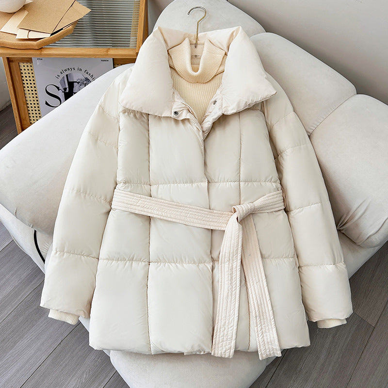 Women's quilted winter jacket with waist belt, stand-up collar, and ribbed cuffs Chichicherry