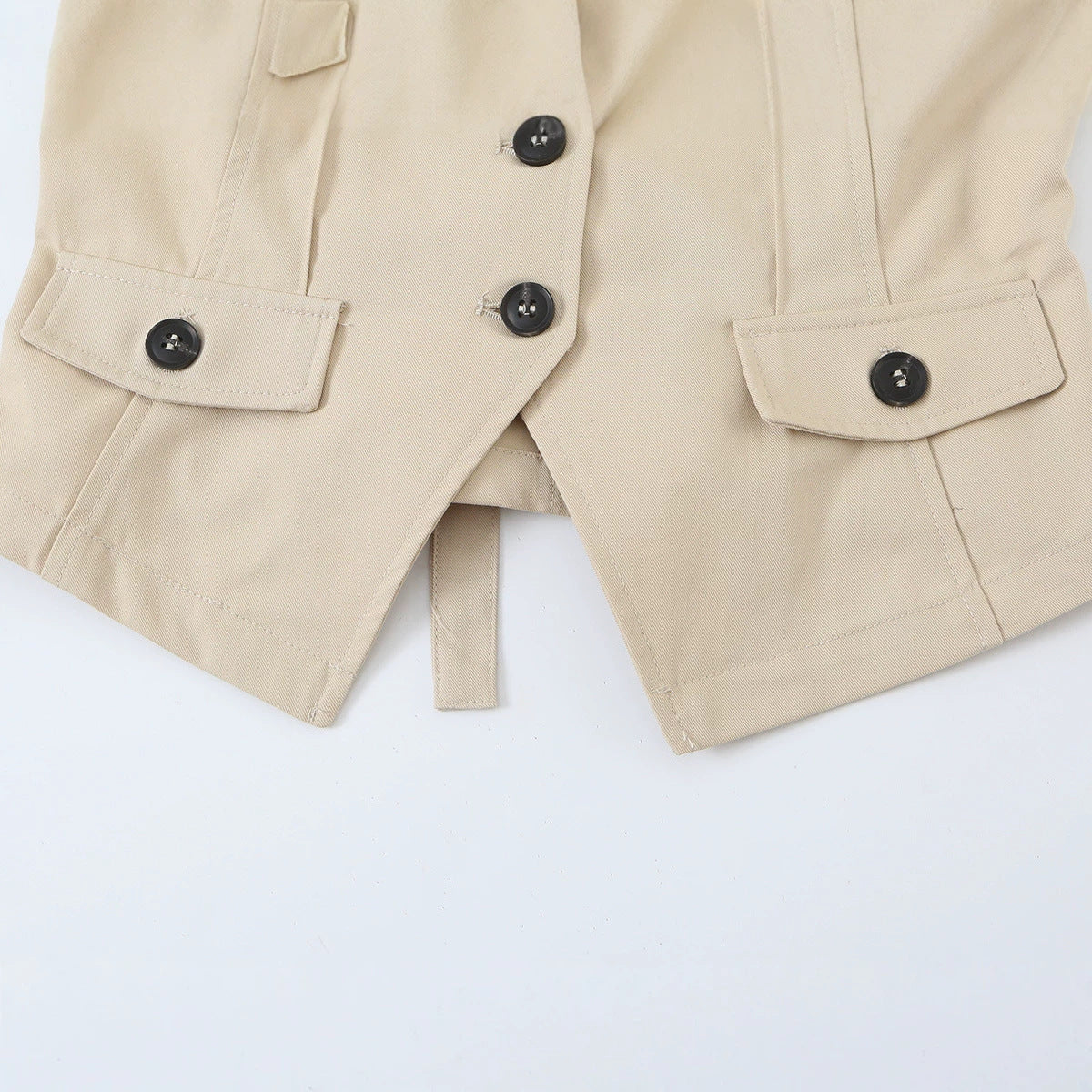 Women's sleeveless tailored trench vest with cut-out, shoulder flaps, and flap pockets Chichicherry