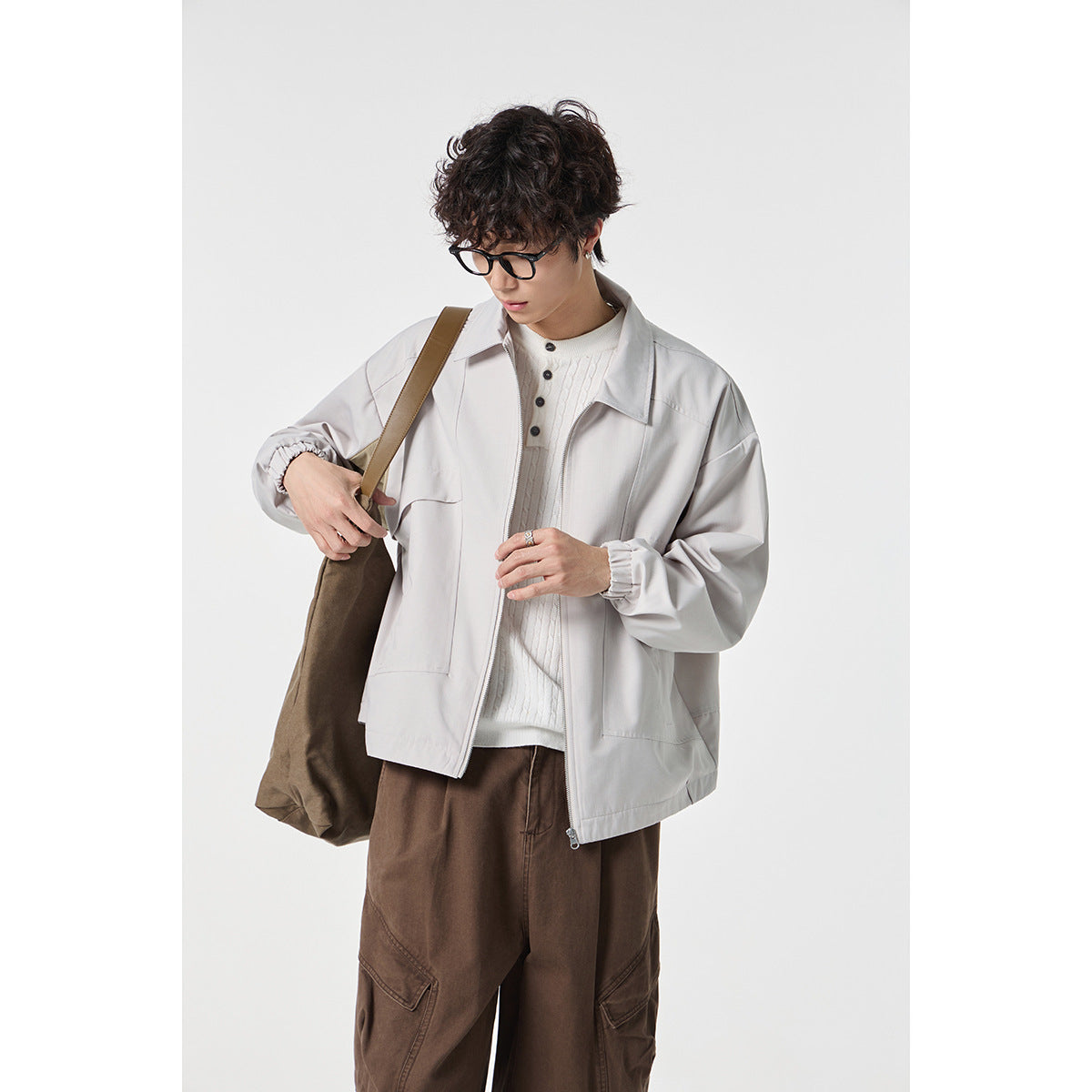 Unisex short jacket in boxy cut with continuous zipper and flap pockets Chichicherry