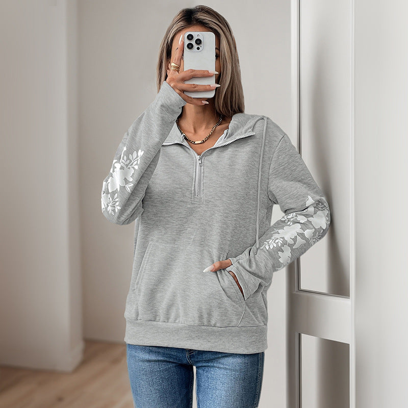 Women's hoodie with half zipper, kangaroo pocket & floral sleeve appliqués Chichicherry