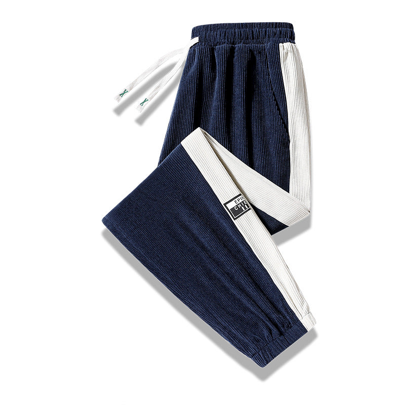 Men's jogging pants made of ribbed cotton blend with contrasting side inserts and elastic hem