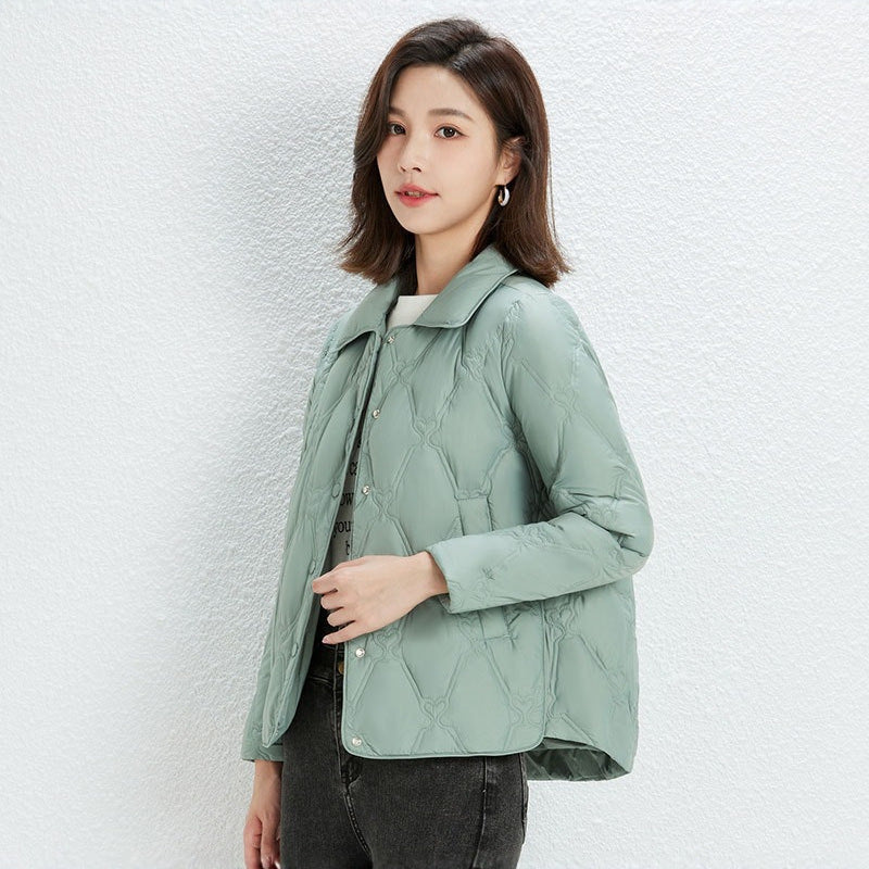 Women Short Cut Quilted Jacket with Decorative Stitching and Rounded Hem Chichicherry