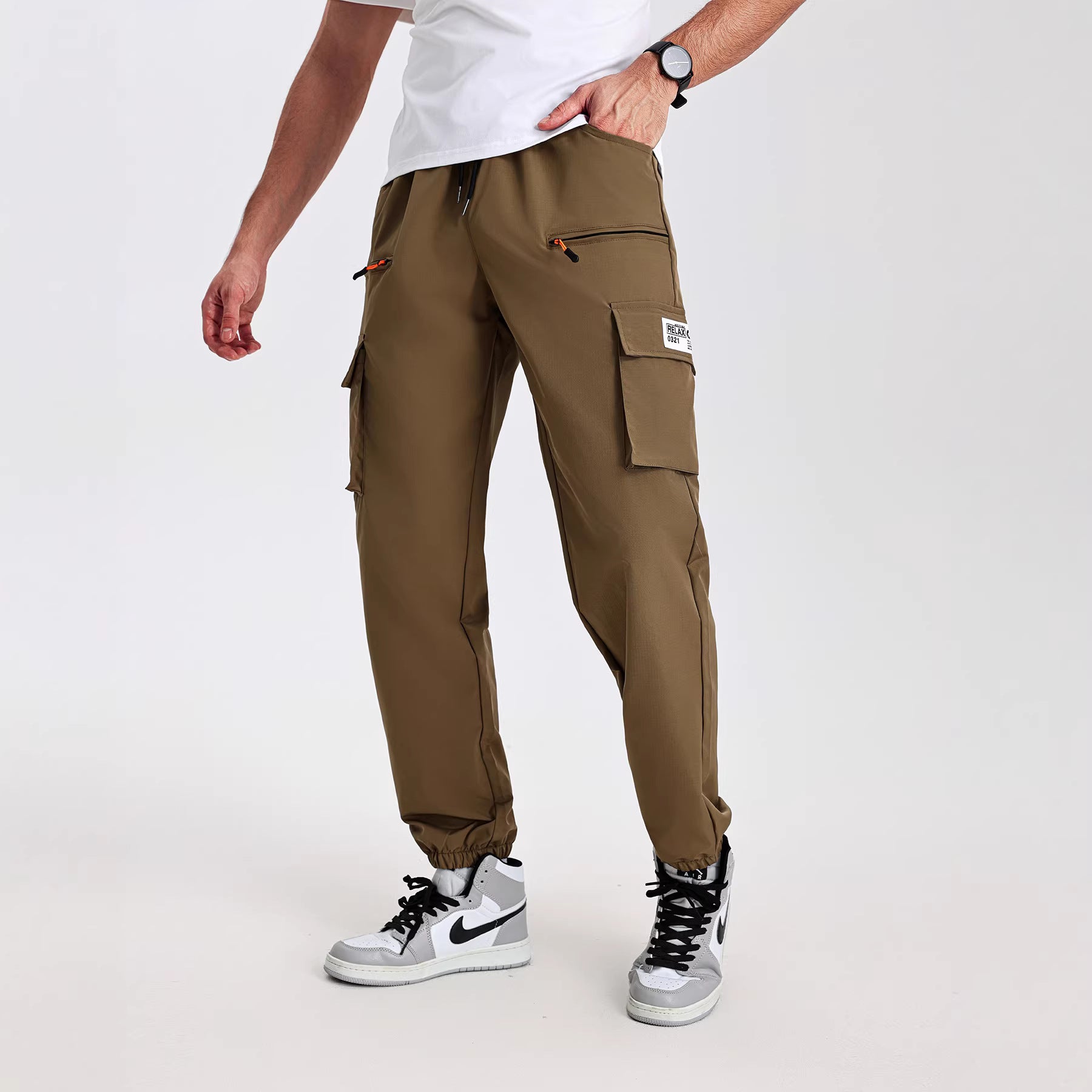 Men's tapered cut utility cargo pants in jogger style with drawstring waistband, zippered pockets & elastic leg cuffs Chichicherry