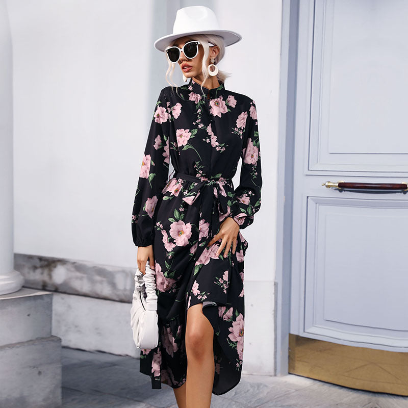 Women's maxi dress with floral allover print, stand collar, long balloon sleeves and ruffle detail.