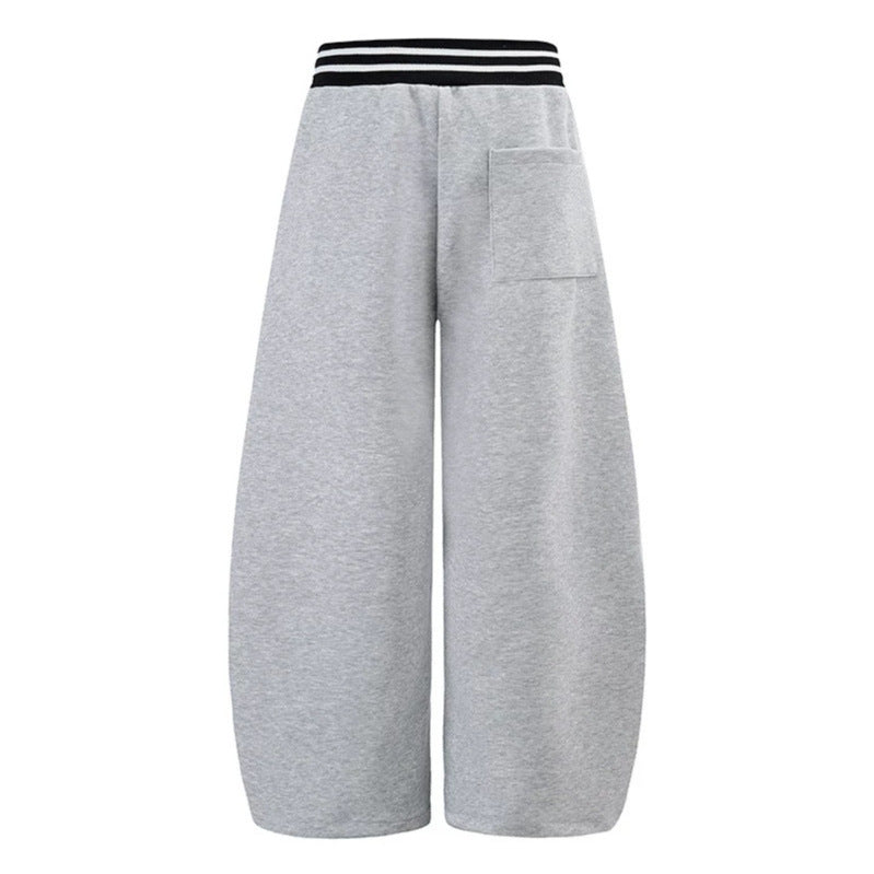 ladies culotte jogging pants with high-contrast waistband, patch pockets, and drawstring hem.