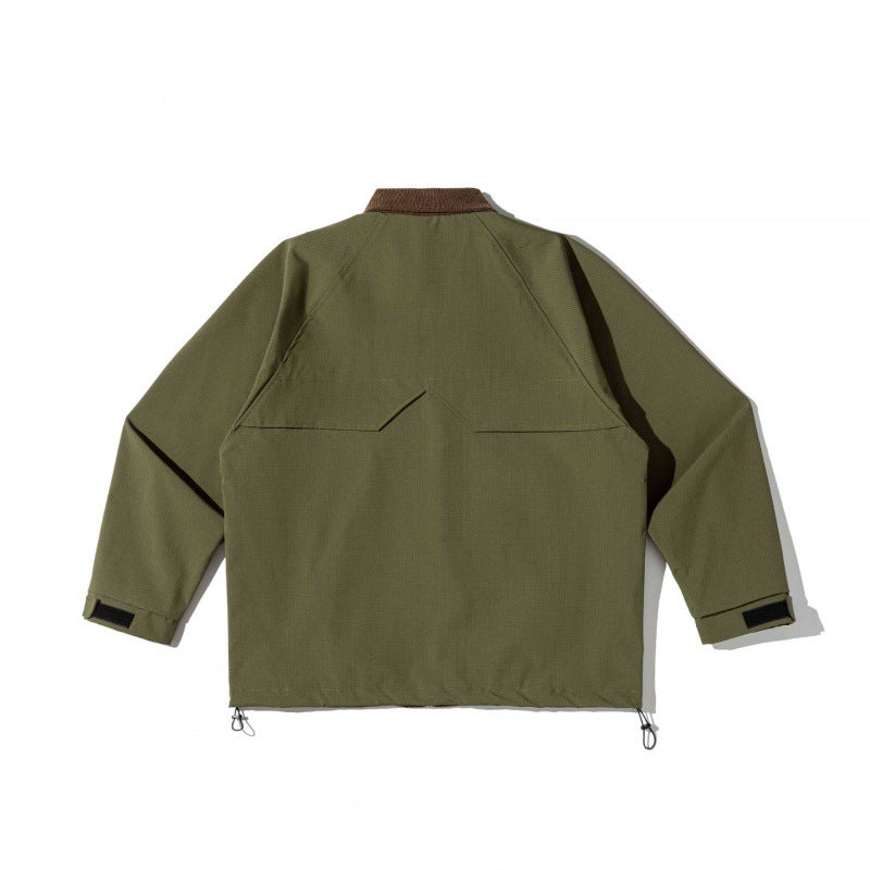 Unisex boxy overshirt jacket in utility style with cord collar, flap pockets and drawstring hem Chichicherry