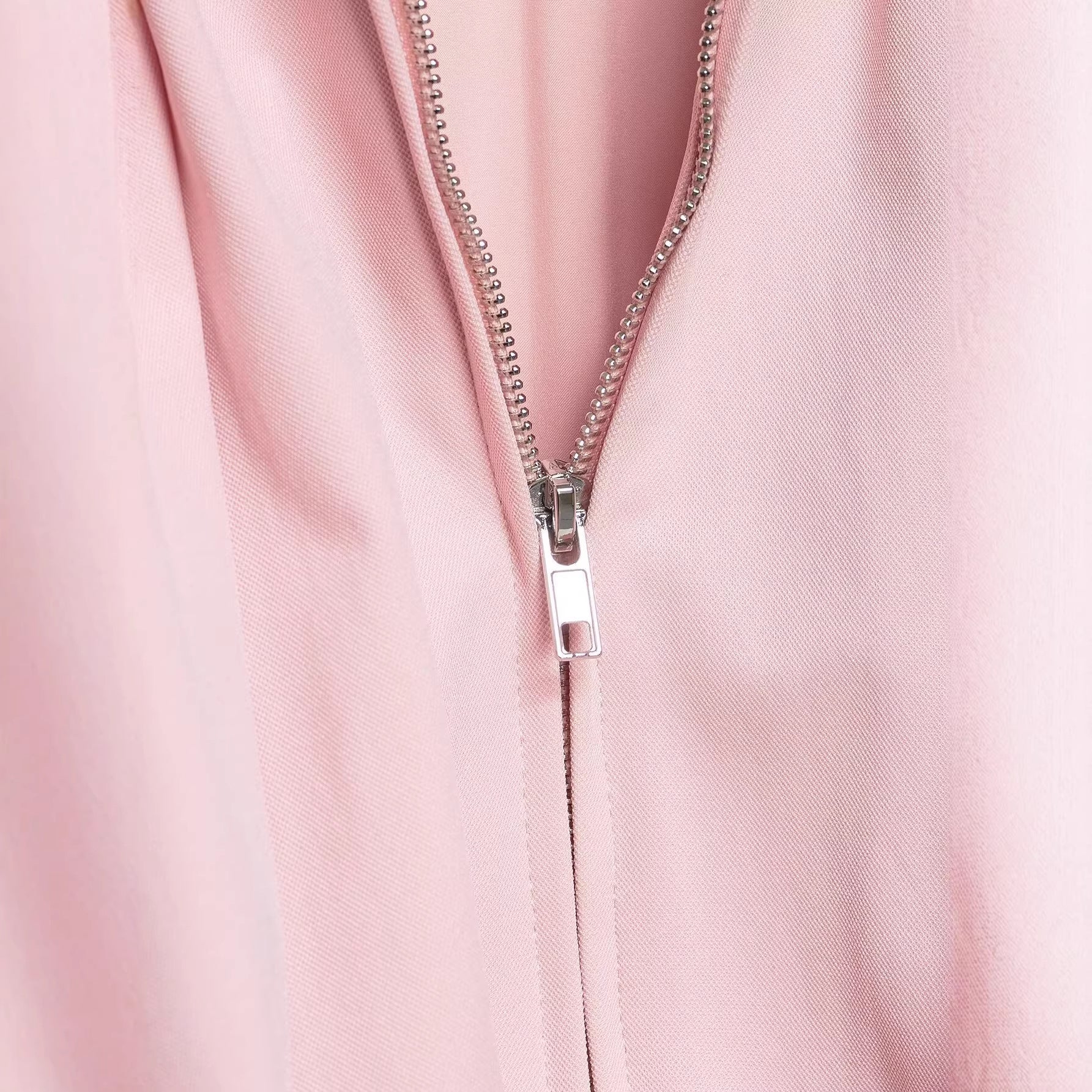 Women's short cut blouson jacket with wide balloon sleeves, zipper, and elastic hem Chichicherry