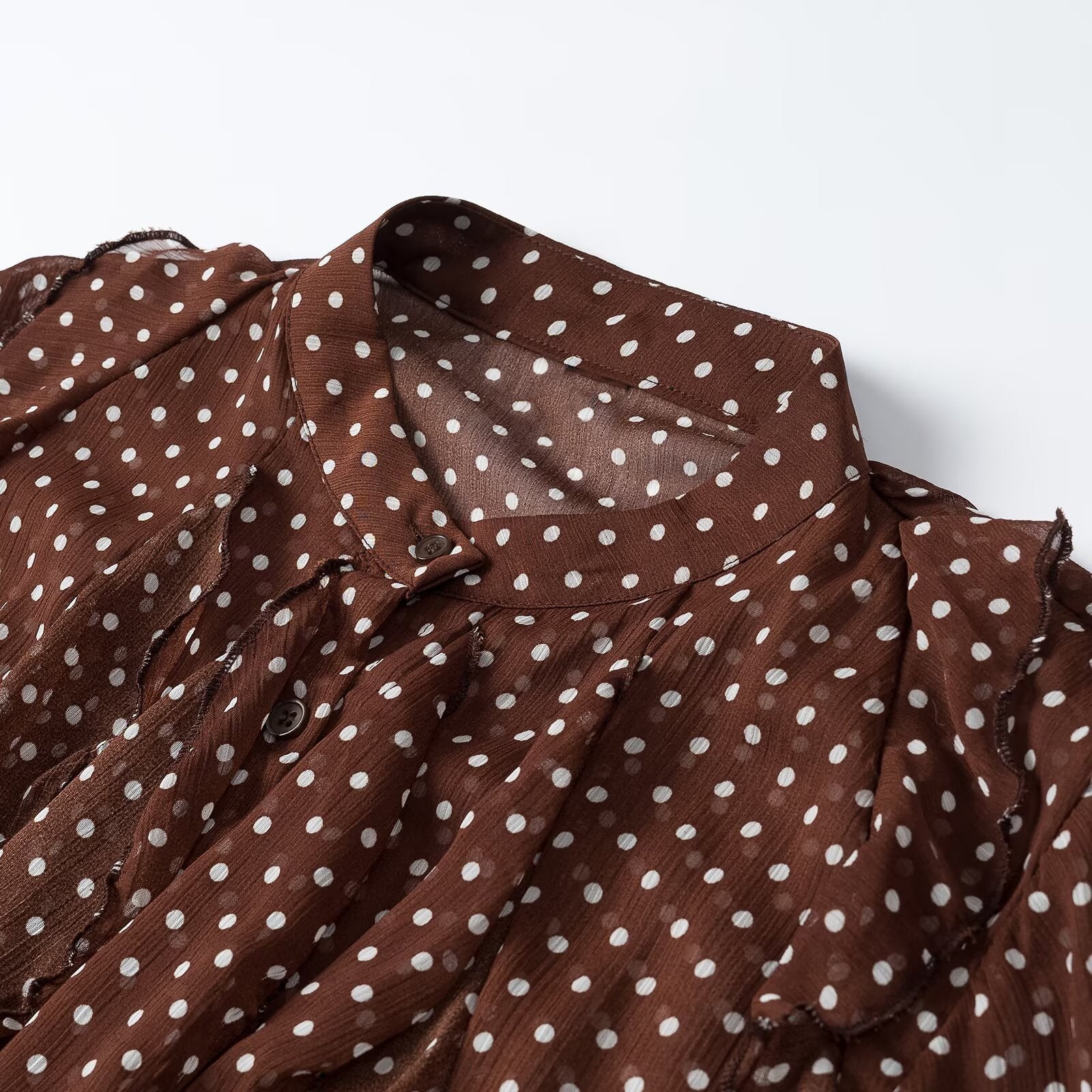 Women's semi-transparent chiffon blouse with dots, ruffle details and bow collar Chichicherry