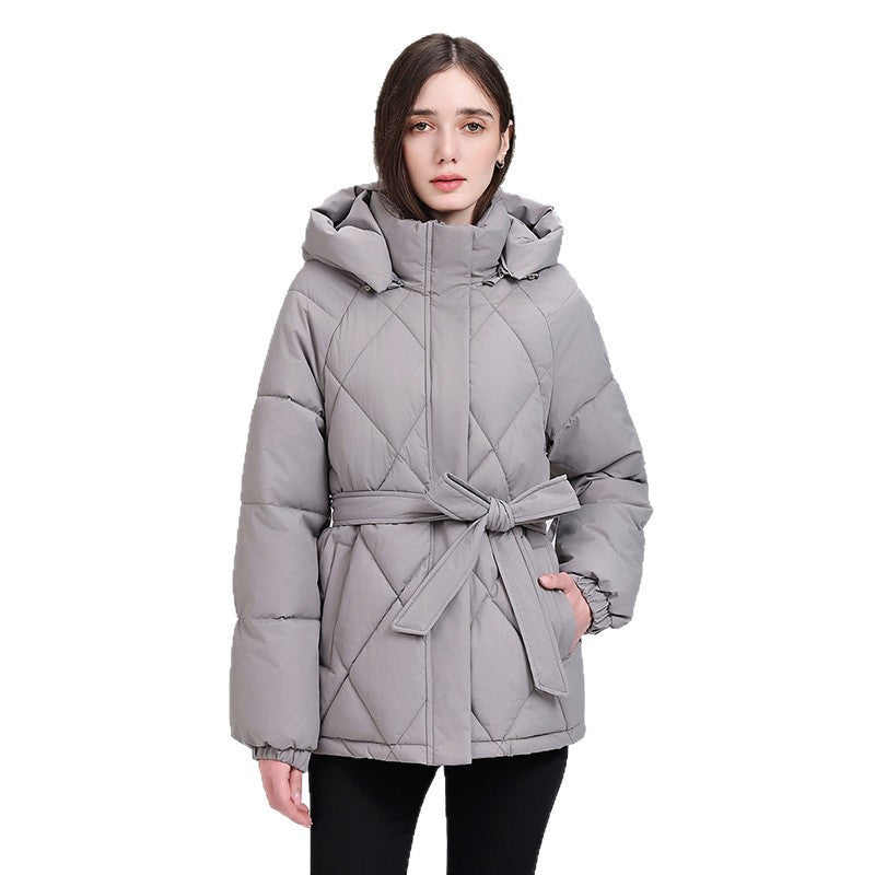 Women's luxury short puffer jacket with integrated wind protection collar and waist belt Chichicherry