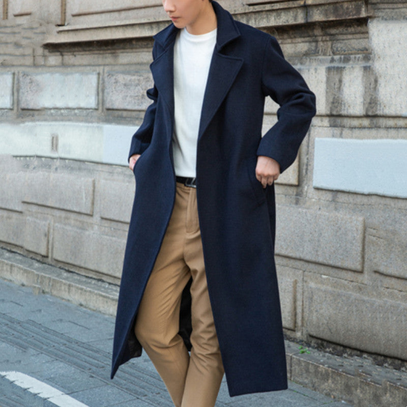 Men's long cut wool coat in minimalist design with generous shawl collar and concealed button placket Chichicherry