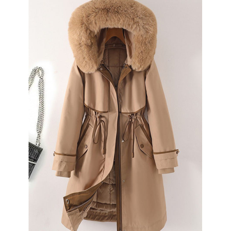 Women's long parka with faux fur hood, waist drawstring, and contrasting piping Chichicherry