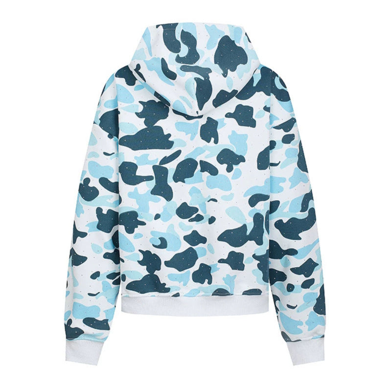 Ladies' hooded jacket in camouflage print with a full-length zipper, kangaroo pocket, and ribbed cuffs.