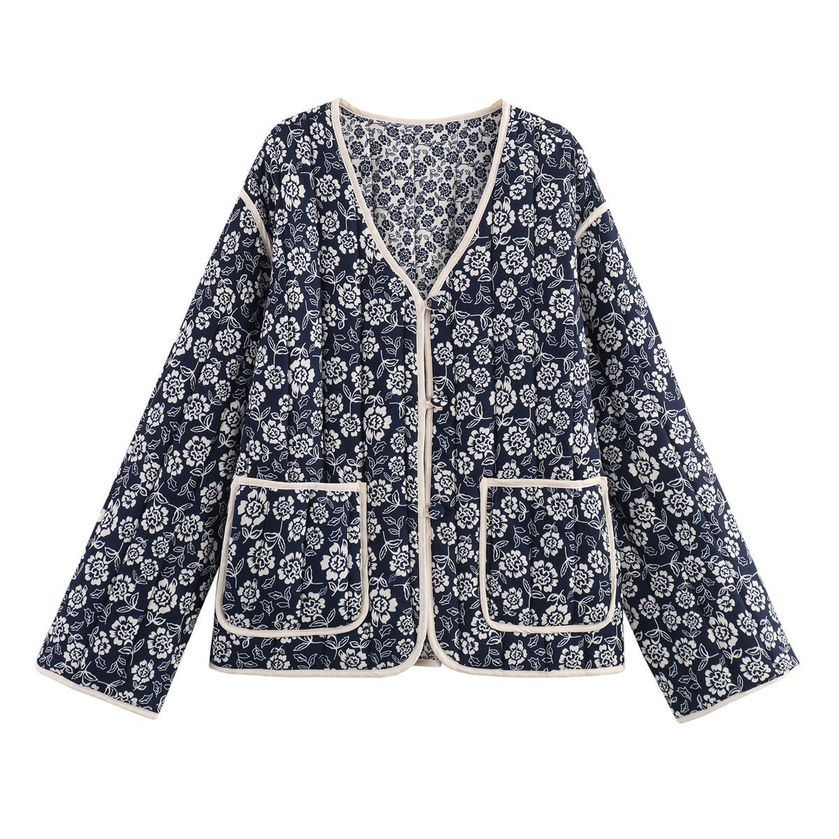 Ladies quilted jacket with floral allover, V-neck, contrast piping and patch pockets Chichicherry