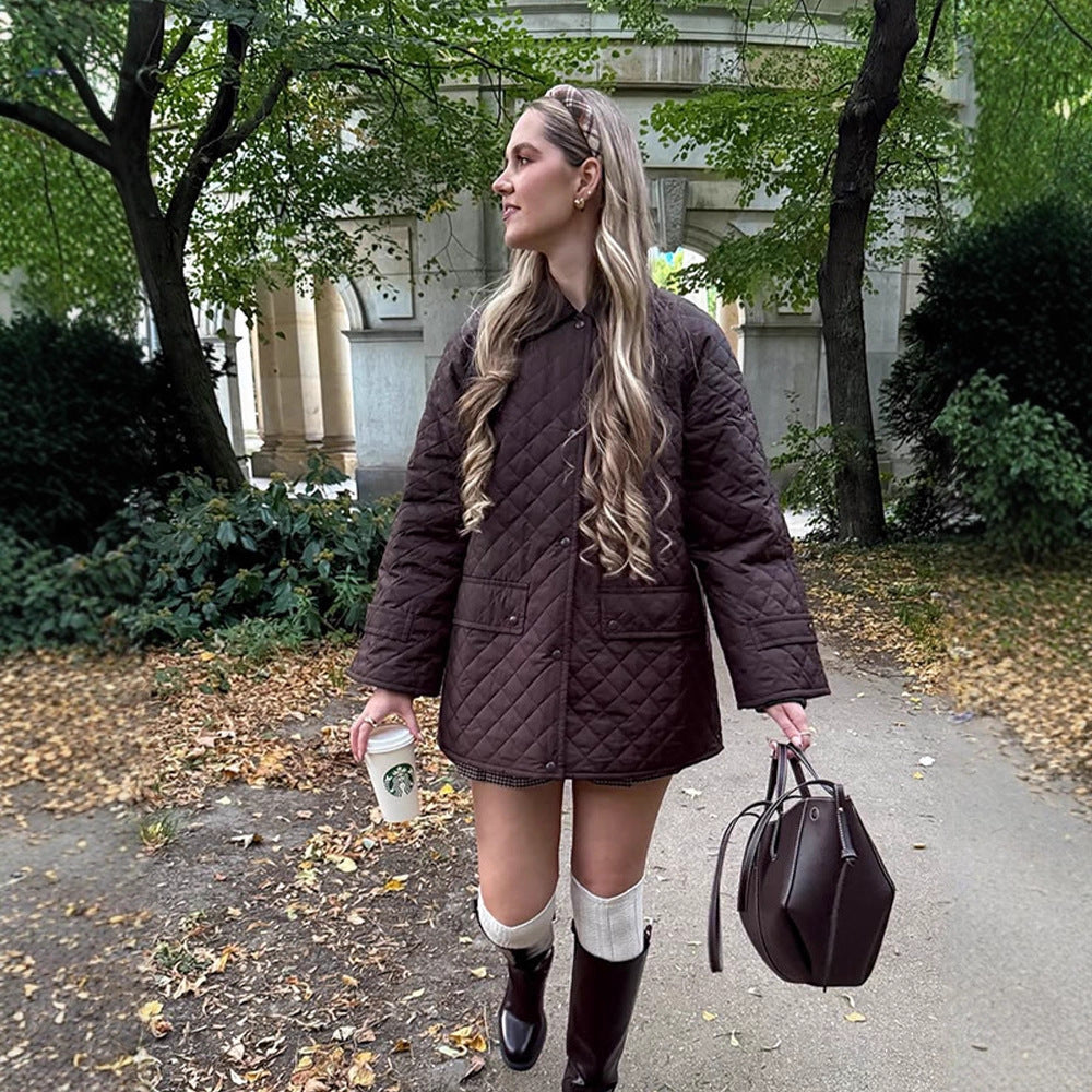 Women's oversized quilted jacket in coat style with snap button placket and patch flap pockets Chichicherry