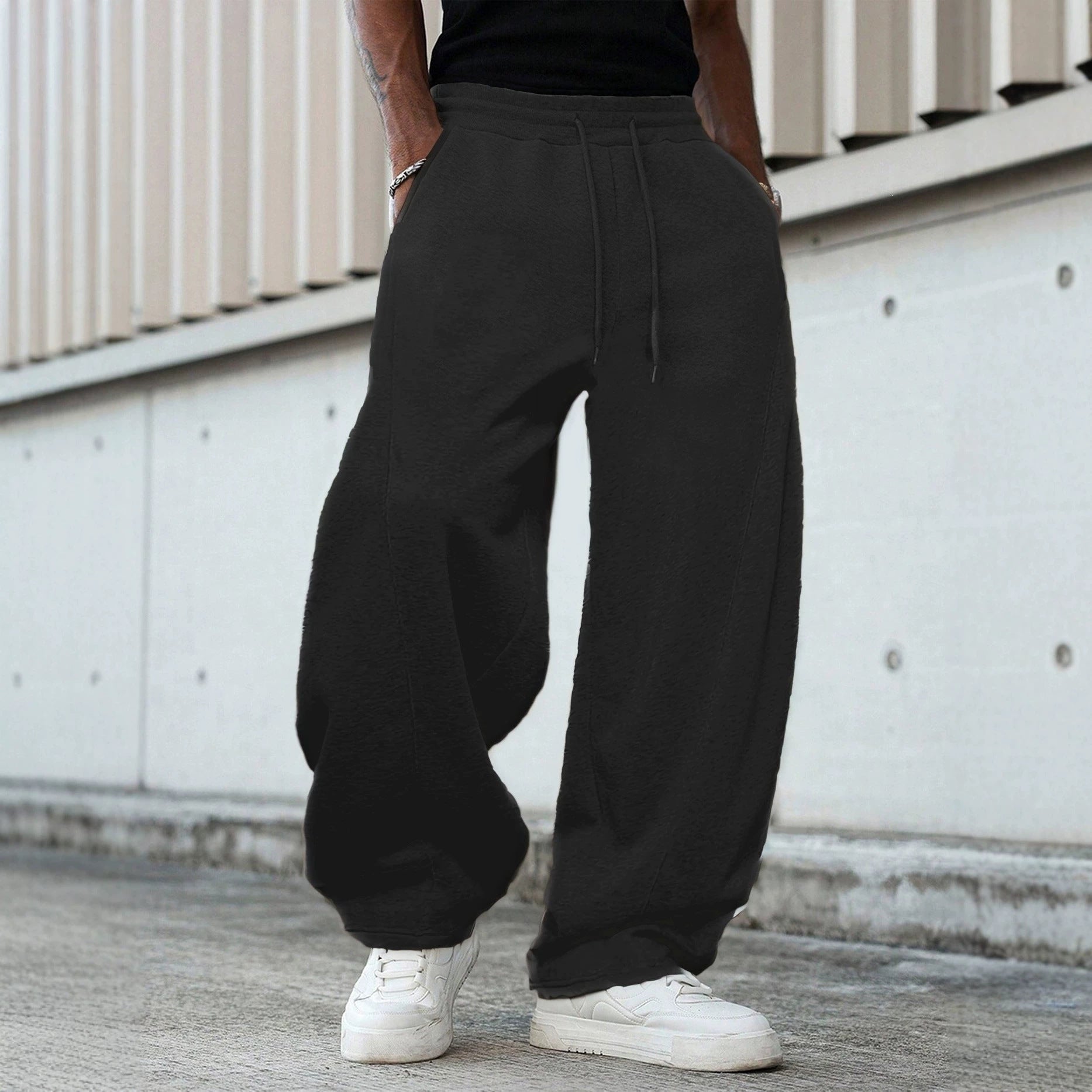 Men's loose sweatpants in baggy cut with elastic waistband, drawstring, and side pockets Chichicherry
